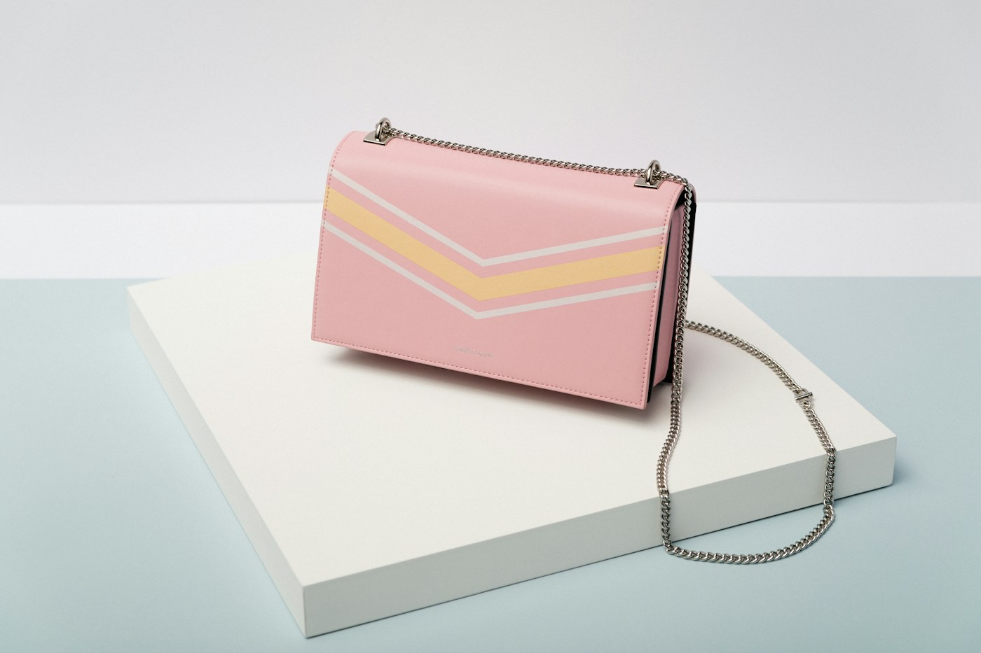 Luxury handbag styled in a fashion editorial setting