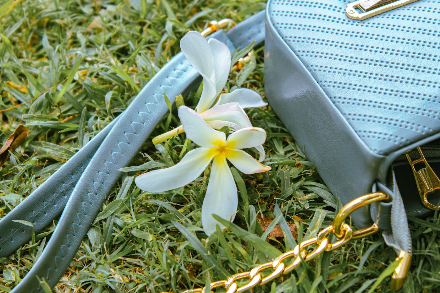 Woman styling a handbag with a modern Indian fashion look